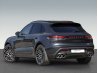 Black premium SUV in rear side view for professional background editing.
