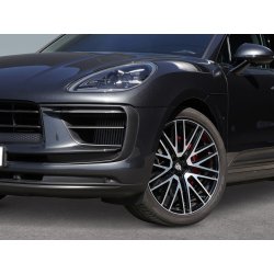Front and wheel detail of a black premium SUV for professional background removal.